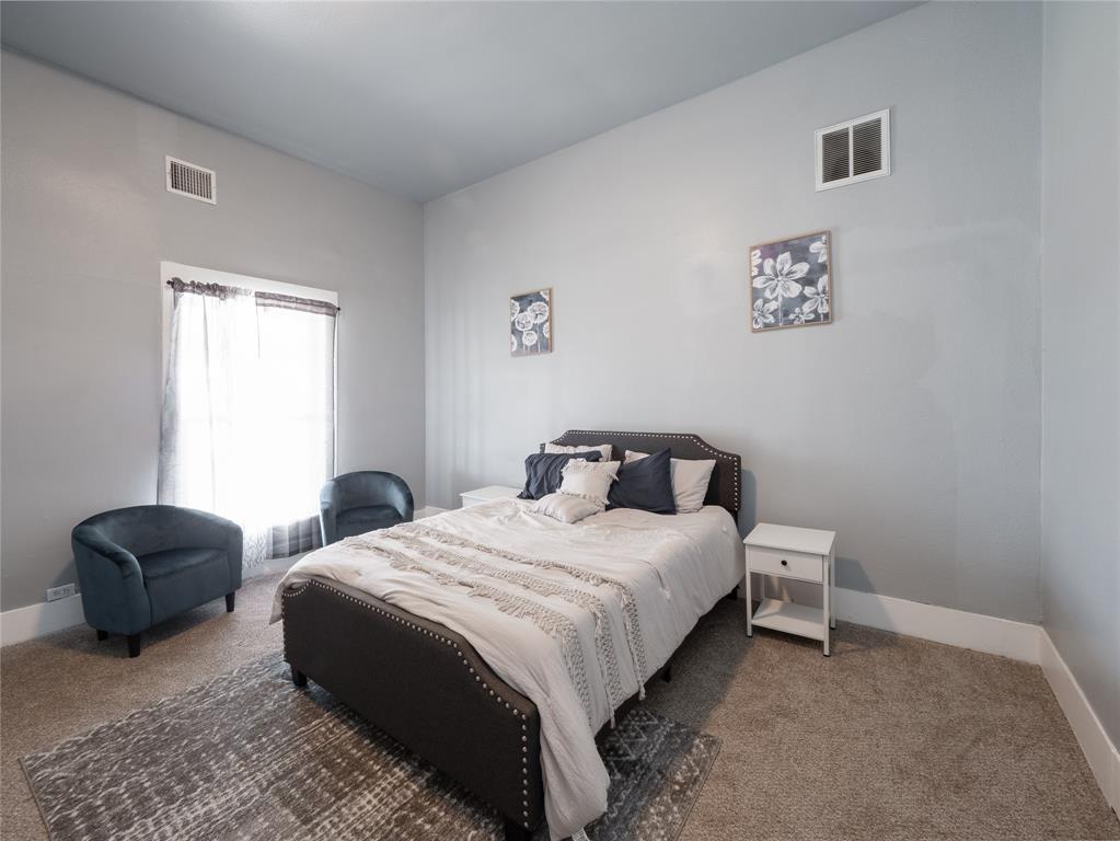 7321 North State Highway Blue Ridge, TX 75424 - Photo 15 of 30 a bedroom with a bed lamp and a window