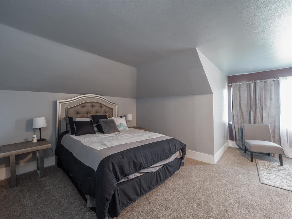 7321 North State Highway Blue Ridge, TX 75424 - Photo 16 of 30 a bedroom with a bed a chair and the window