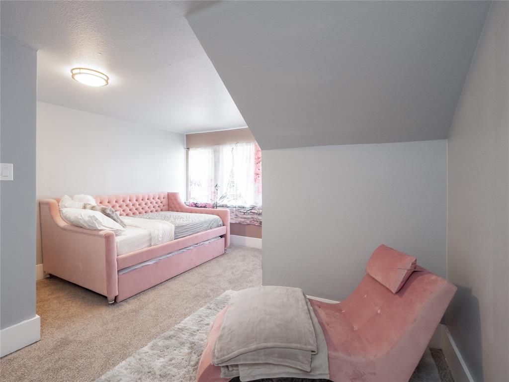 7321 North State Highway Blue Ridge, TX 75424 - Photo 17 of 30 a bedroom with a bed and a couch