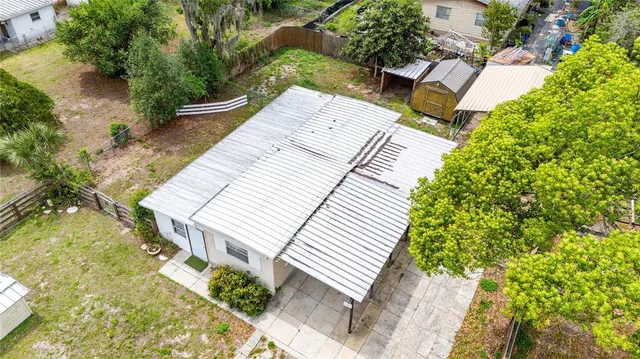 a view of a backyard with sitting area