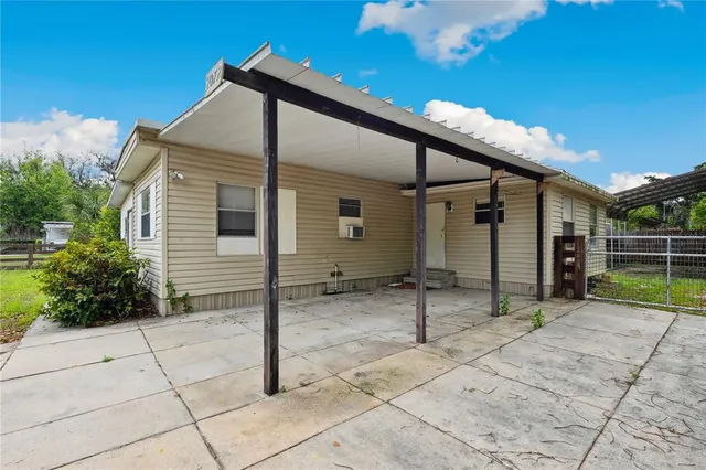 a backyard of a house with seating space