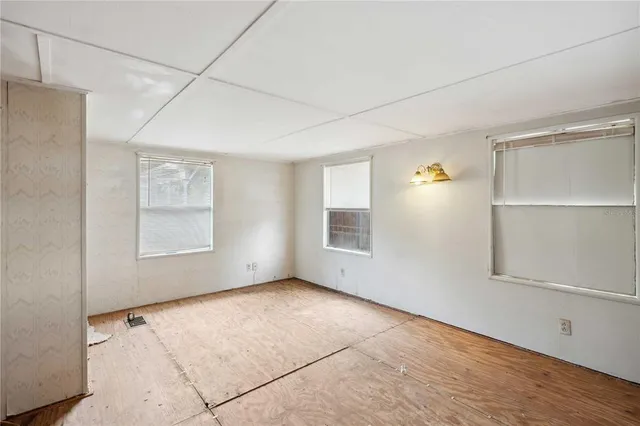 a view of an empty room with a window