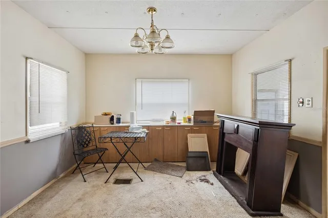 a workspace with furniture window and wooden floor