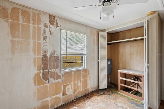 a view of an empty room with a window