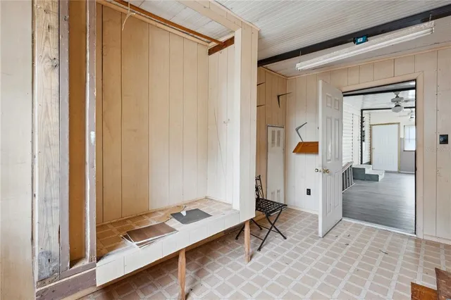 a view of workspace with wooden floor and bathroom