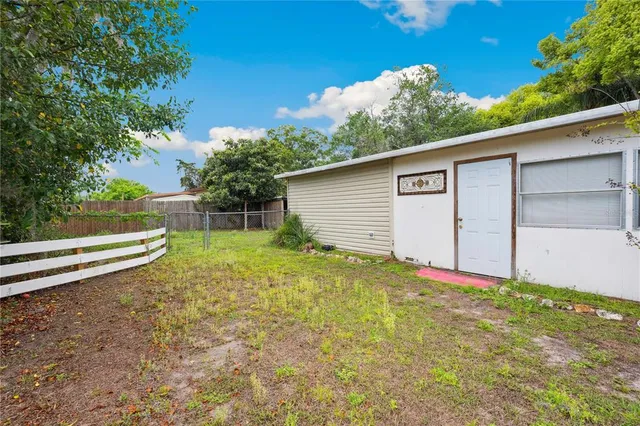a view of backyard with outdoor space