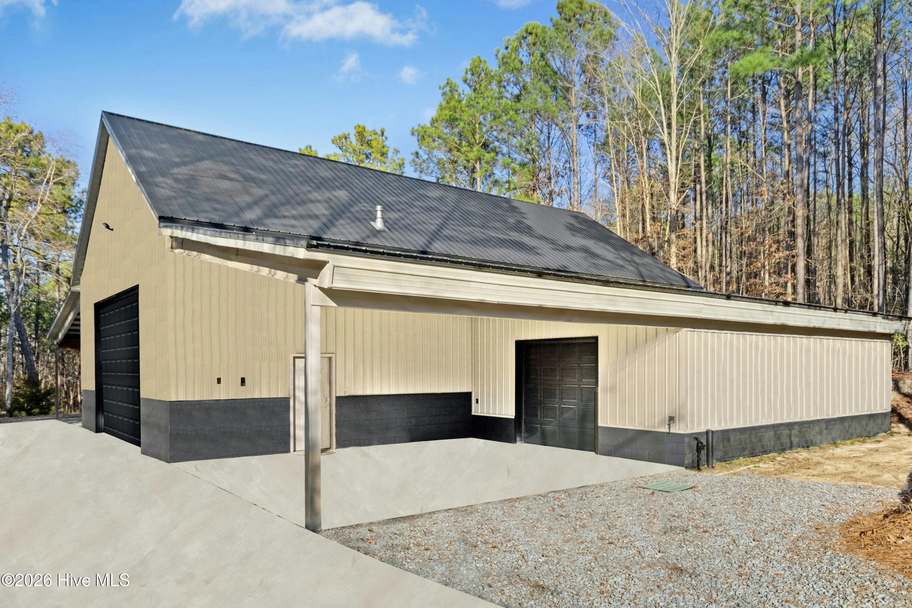 9192 New Sandy Hill Church Road Middlesex, NC 27557 - Photo 29 of 37 Covered Patio with a separate workshop entrance. All 2493 S/F heated and cooled