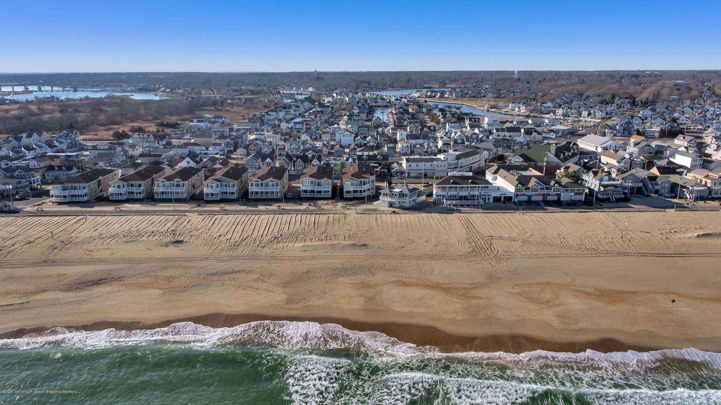 209 Beach Front, Unit 1 Manasquan, NJ 08736 - Photo 33 of 40 an aerial view of residential building and ocean