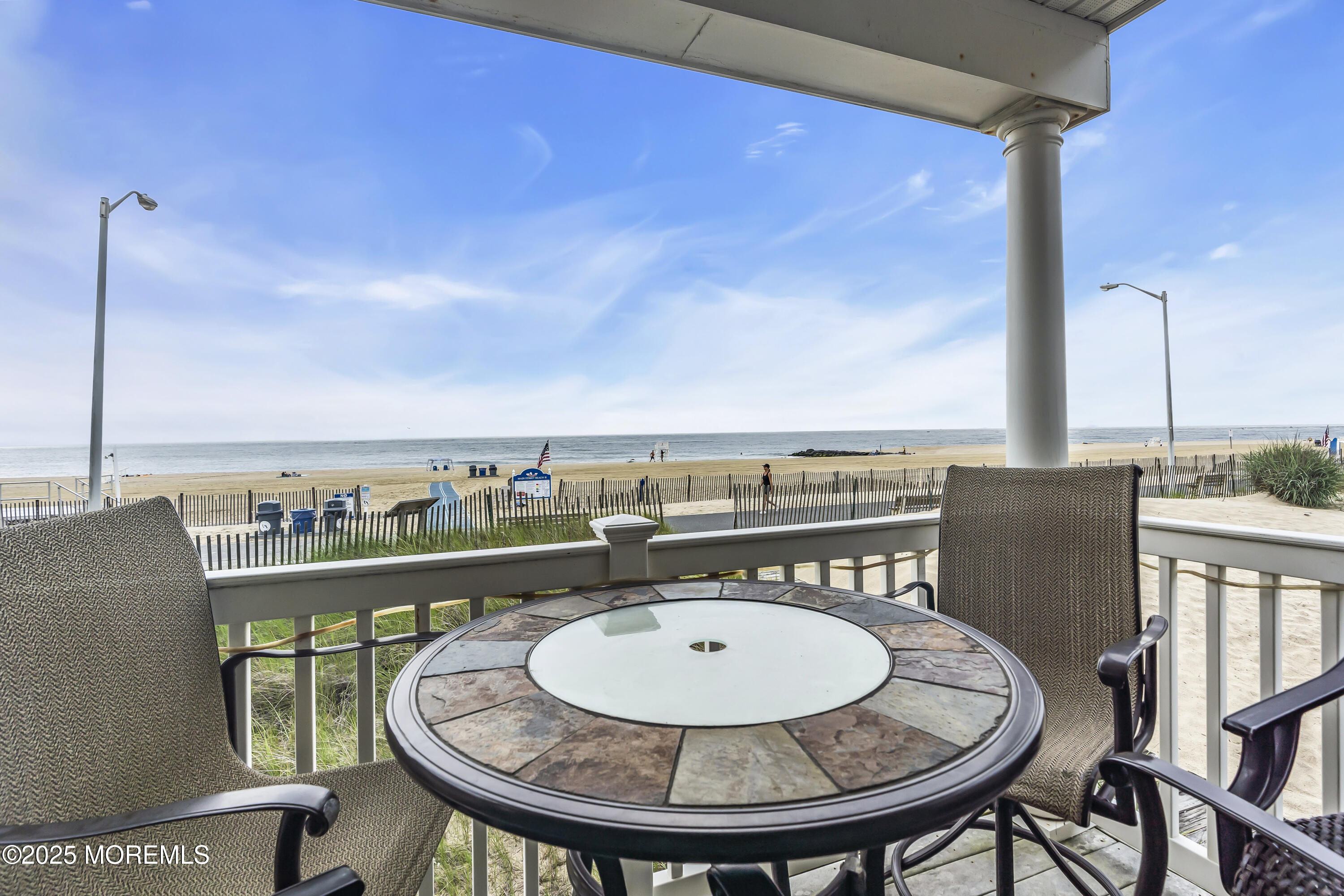 209 Beach Front, Unit 1 Manasquan, NJ 08736 - Photo 8 of 40 a view of a balcony with furniture
