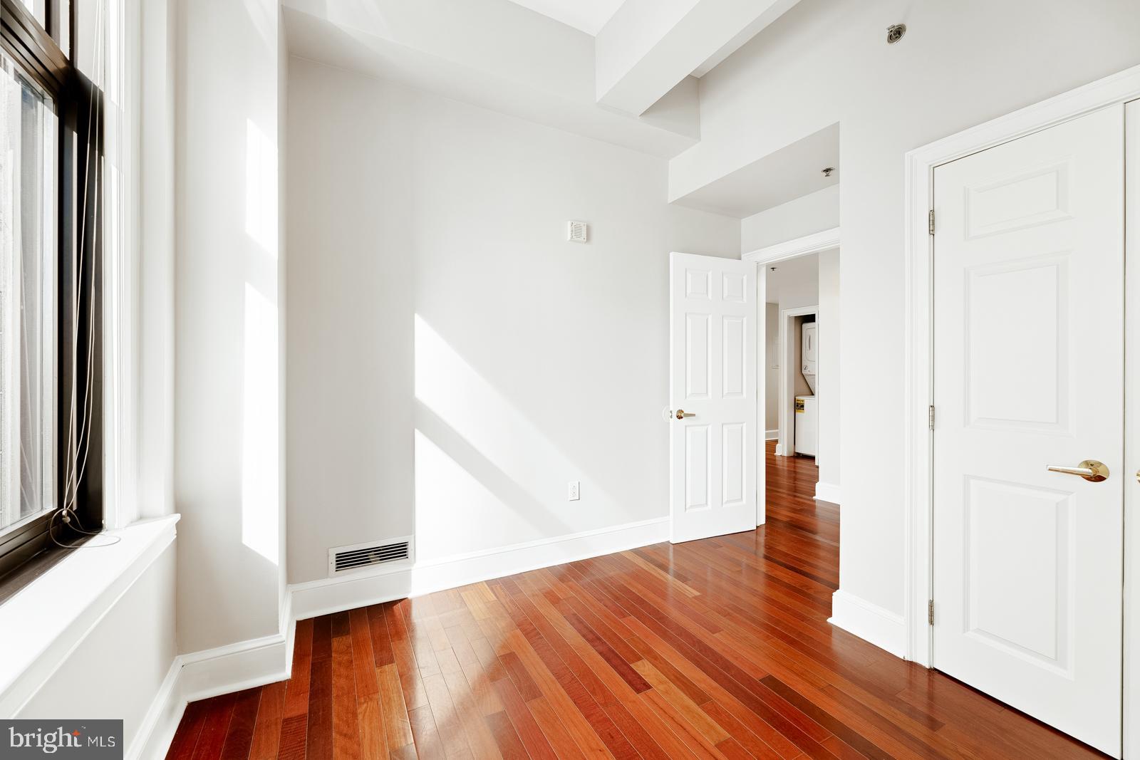 1500-00 Chestnut Street, Unit 19F Philadelphia, PA 19102 - Photo 2 of 33 a view of an empty room with wooden floor