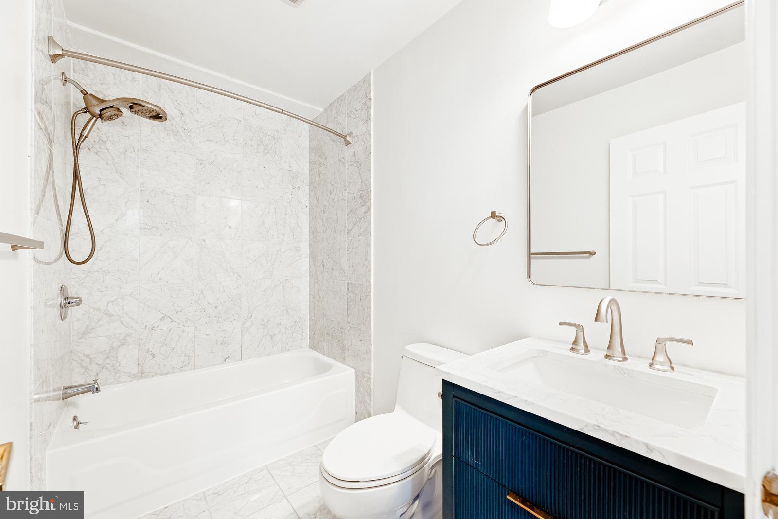 1500-00 Chestnut Street, Unit 19F Philadelphia, PA 19102 - Photo 24 of 33 a bathroom with a granite countertop sink a toilet and shower
