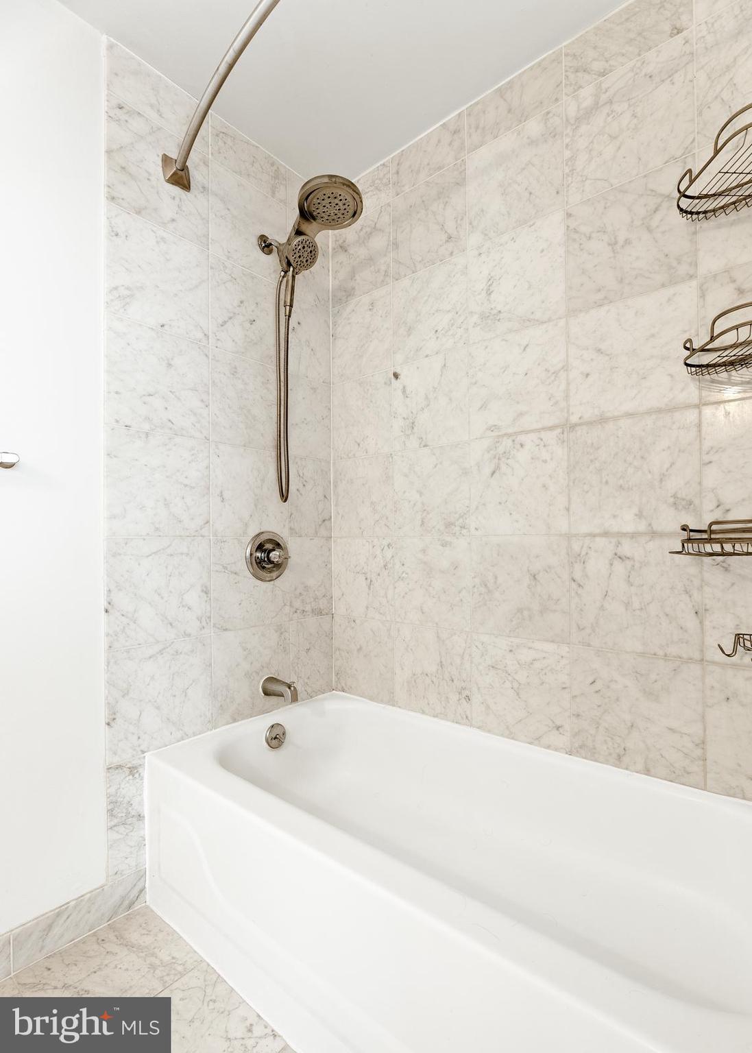 1500-00 Chestnut Street, Unit 19F Philadelphia, PA 19102 - Photo 31 of 33 a bathroom with a bathtub