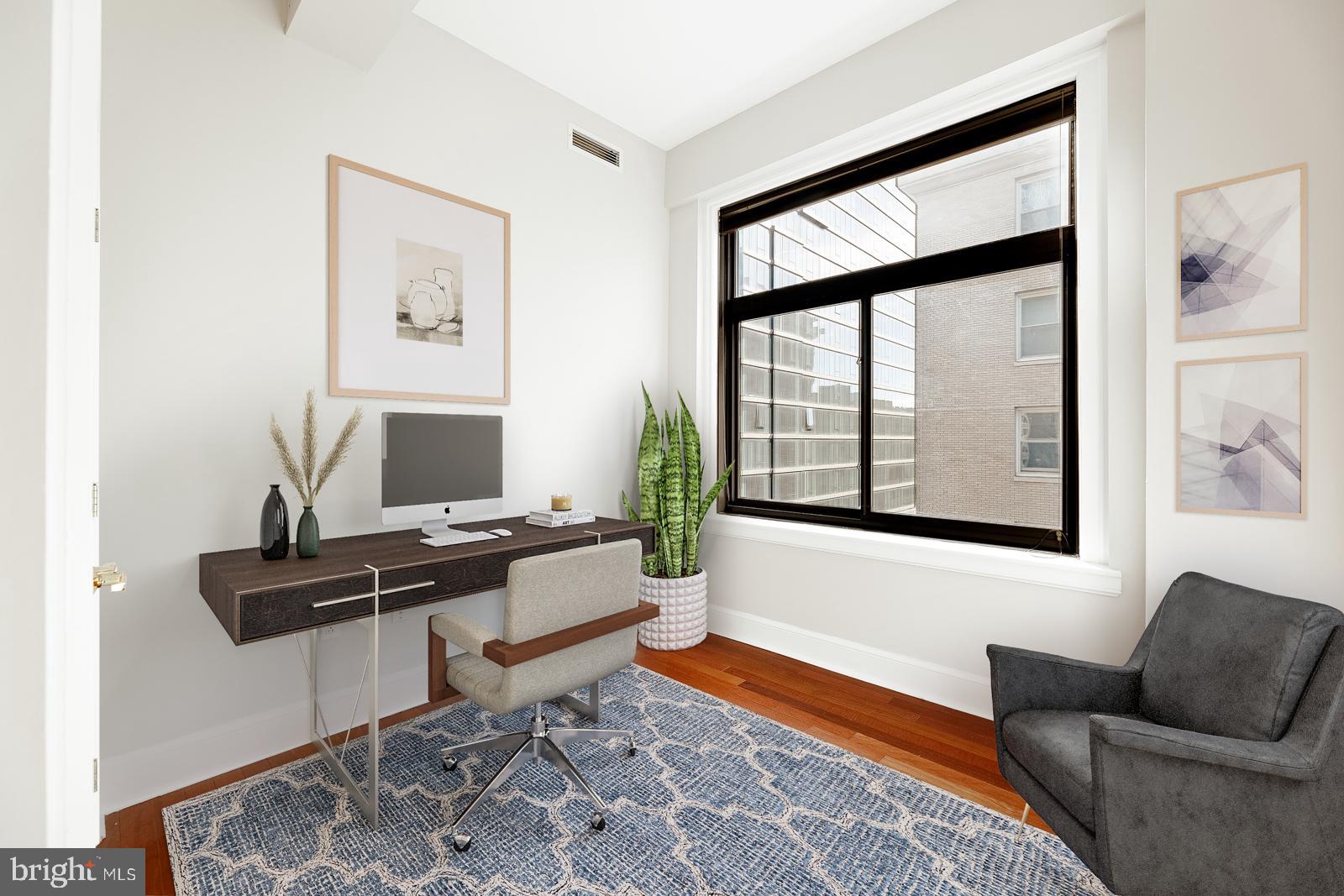 1500-00 Chestnut Street, Unit 19F Philadelphia, PA 19102 - Photo 8 of 33 a living room with furniture and a window