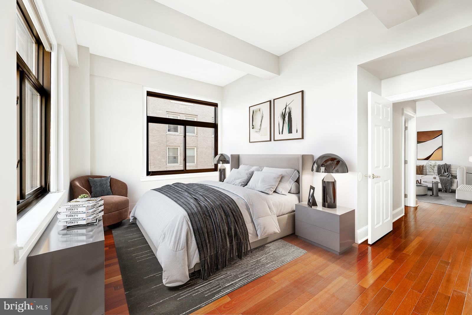 1500-00 Chestnut Street, Unit 19F Philadelphia, PA 19102 - Photo 9 of 33 a bedroom with a bed and a large window