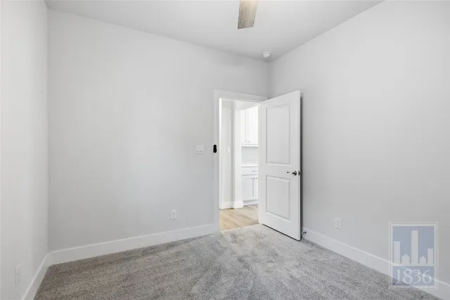an empty room with closet area