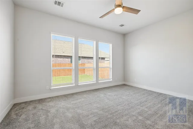 an empty room with a empty space and a window