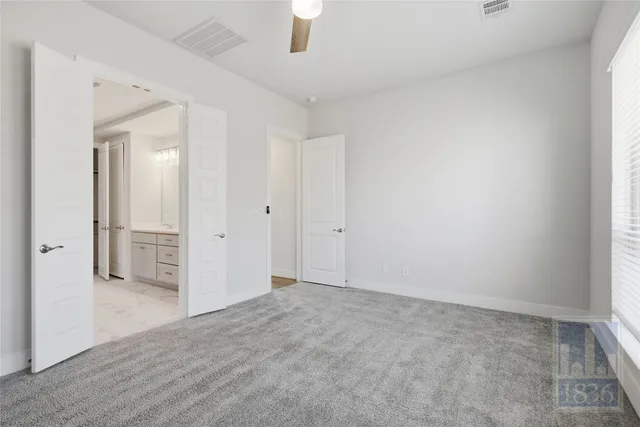 an empty room with a bathroom