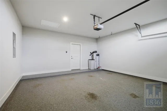 an empty room with a ceiling fan and a window