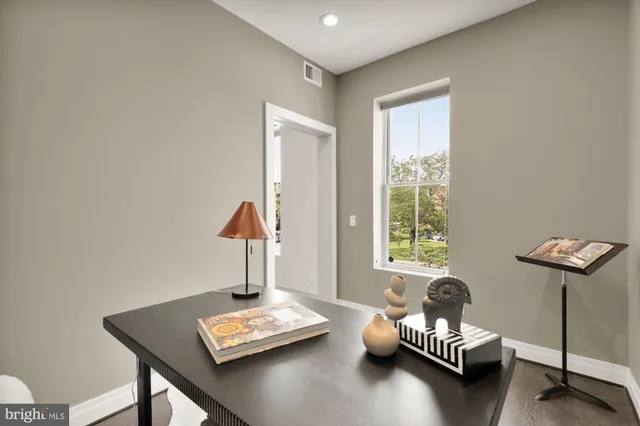 a room with furniture and a potted plant