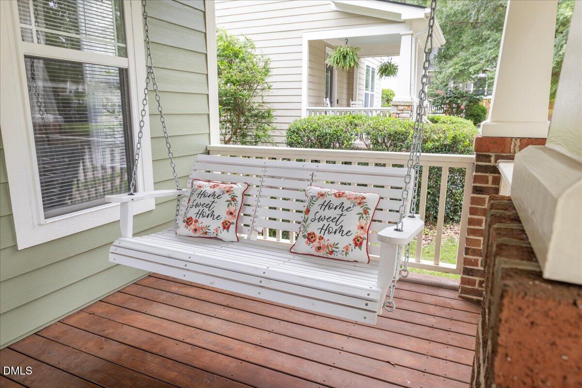 3205 Suncrest Village Lane Raleigh, NC 27616 - Photo 2 of 29 a view of a wooden deck with a bench