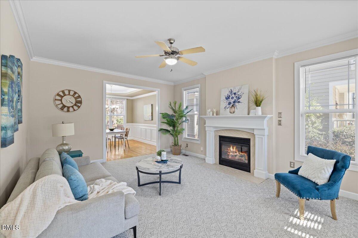 3205 Suncrest Village Lane Raleigh, NC 27616 - Photo 3 of 29 a living room with furniture and a fireplace