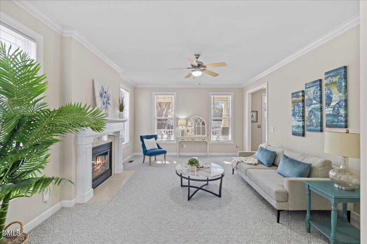 3205 Suncrest Village Lane Raleigh, NC 27616 - Photo 4 of 29 a living room with furniture and a large window