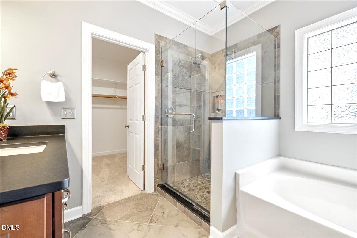 3205 Suncrest Village Lane Raleigh, NC 27616 - Photo 9 of 29 a bathroom with a shower and a sink