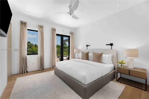 a bed room with a bed and a window