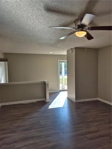 a kitchen with a refrigerator and cabinets