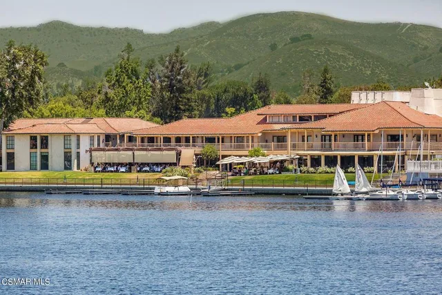 a front view of houses with yard