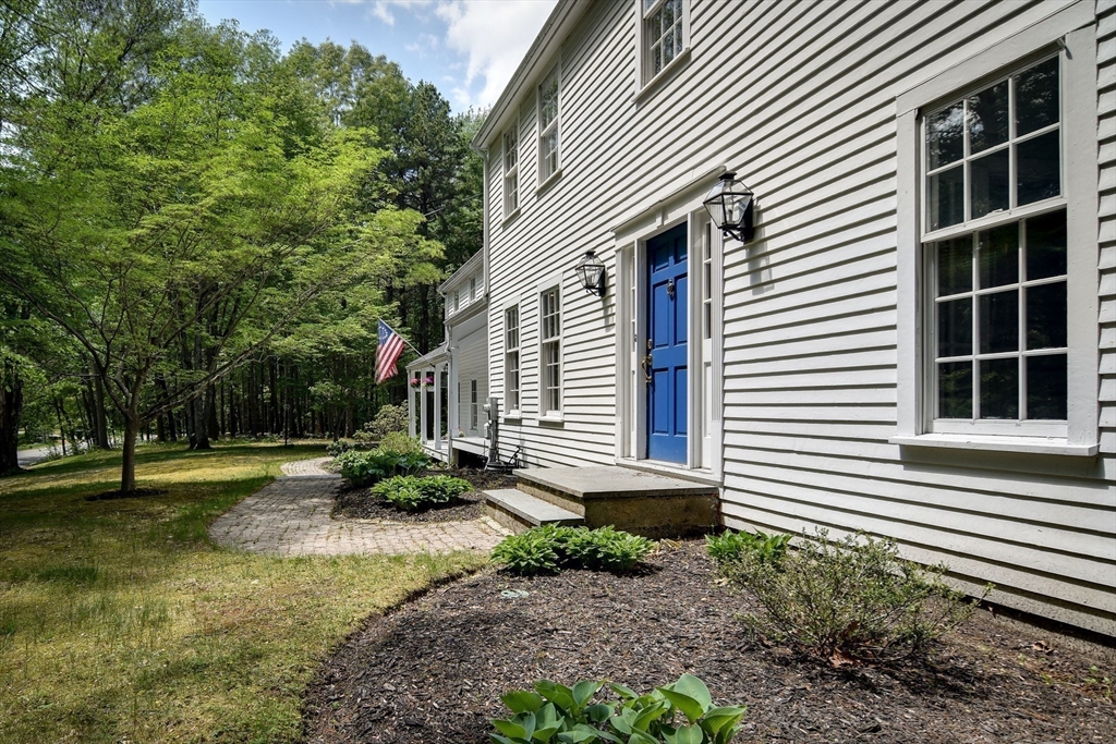 114 Hunters Ridge Road Concord, MA 01742 - Photo 4 of 38 a front view of a house with a yard