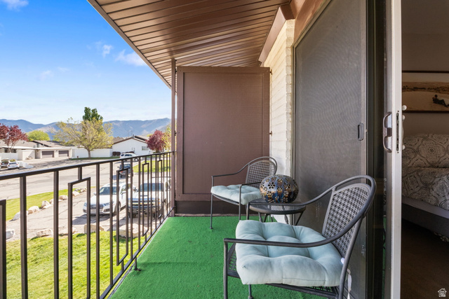 41 Benchmark Village Tooele, UT 84074 - Photo 13 of 26 Balcony featuring a mountain view and a residential view