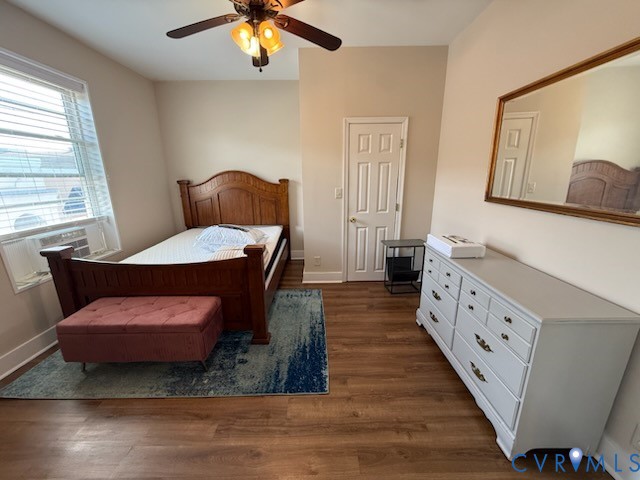 101 South Main Street, Unit B Blackstone, VA 23824 - Photo 6 of 7 a spacious bedroom with a bed and a chandelier