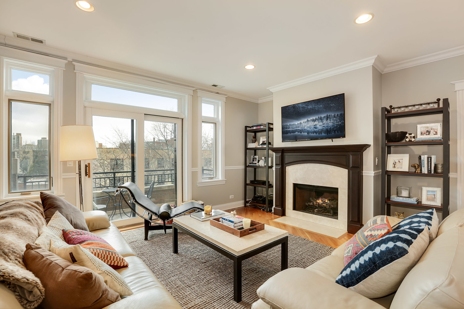 456 West Briar Place, Unit 4 Chicago, IL 60657 - Photo 2 of 30 a living room with furniture a flat screen tv and a fireplace