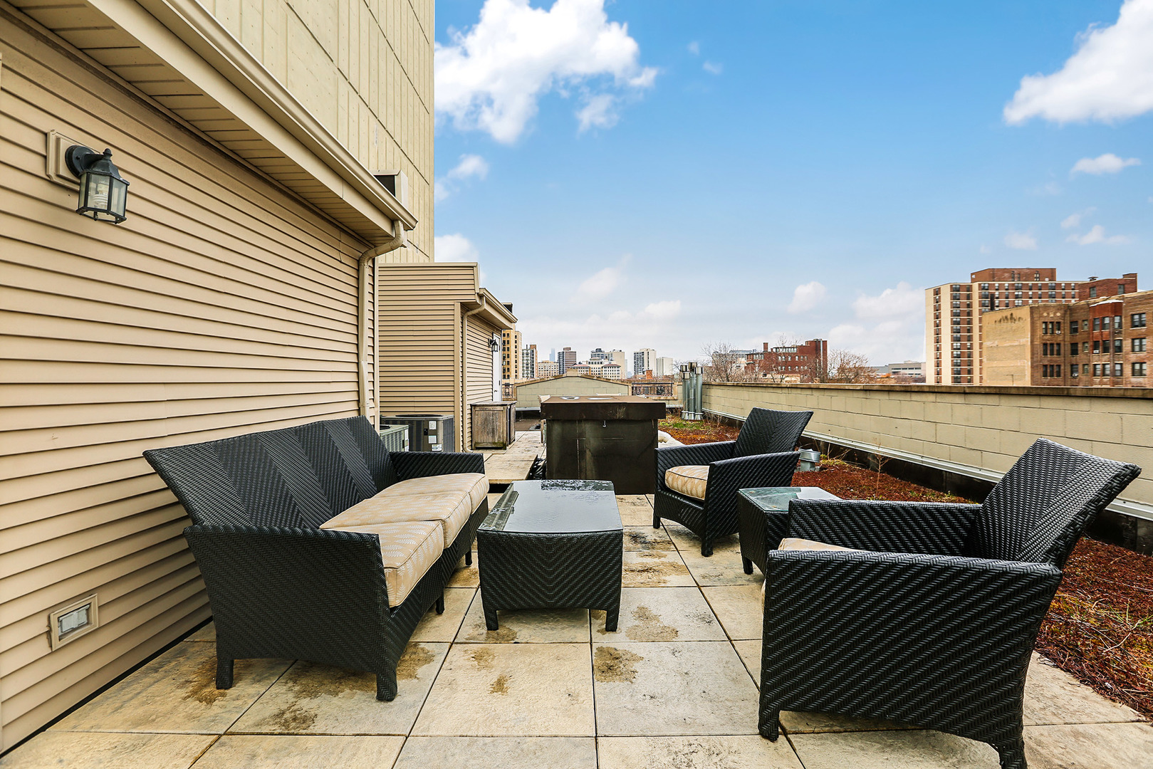 456 West Briar Place, Unit 4 Chicago, IL 60657 - Photo 25 of 30 a roof deck with a couch and chairs