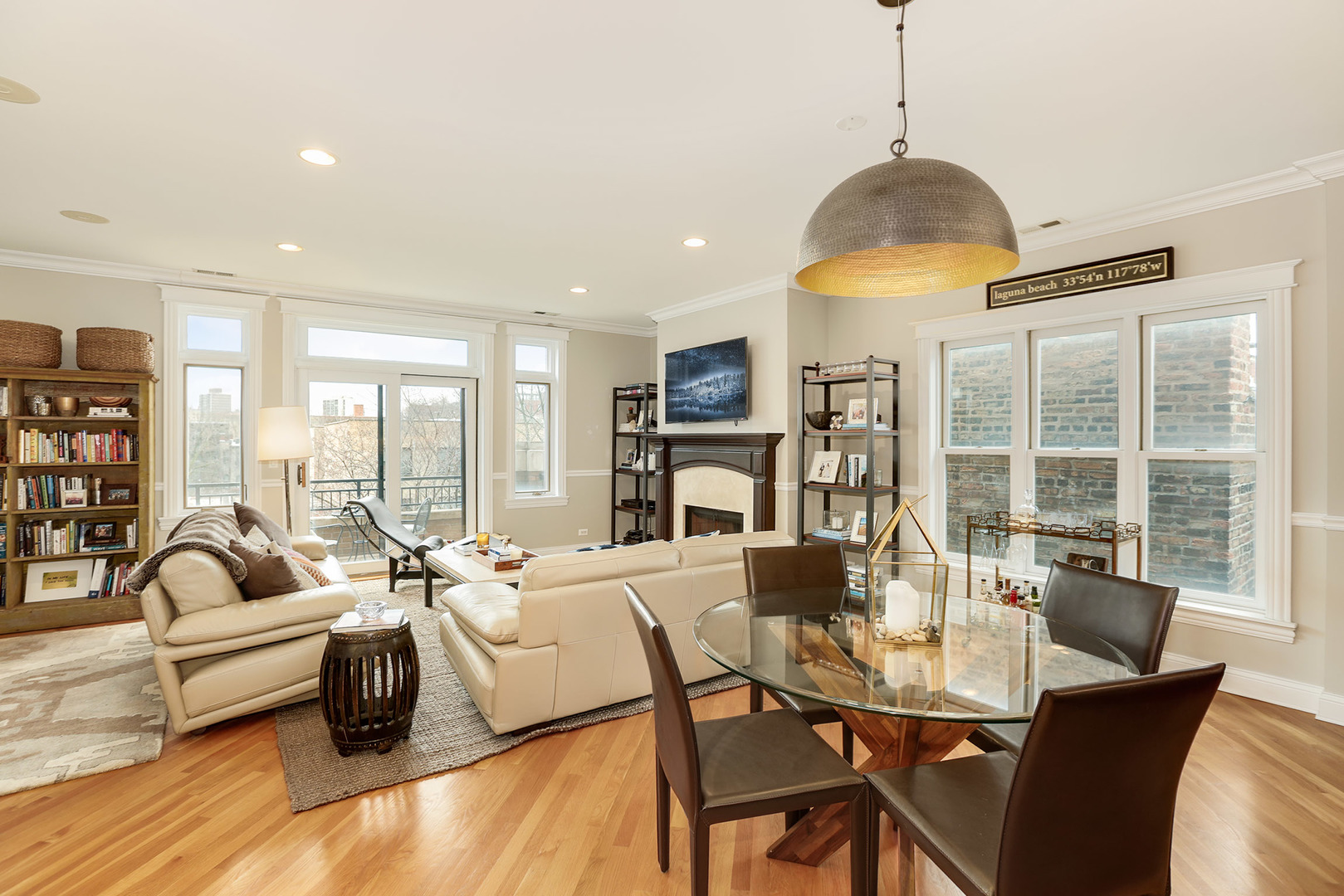 456 West Briar Place, Unit 4 Chicago, IL 60657 - Photo 6 of 30 a living room with furniture a dining table and a chandelier