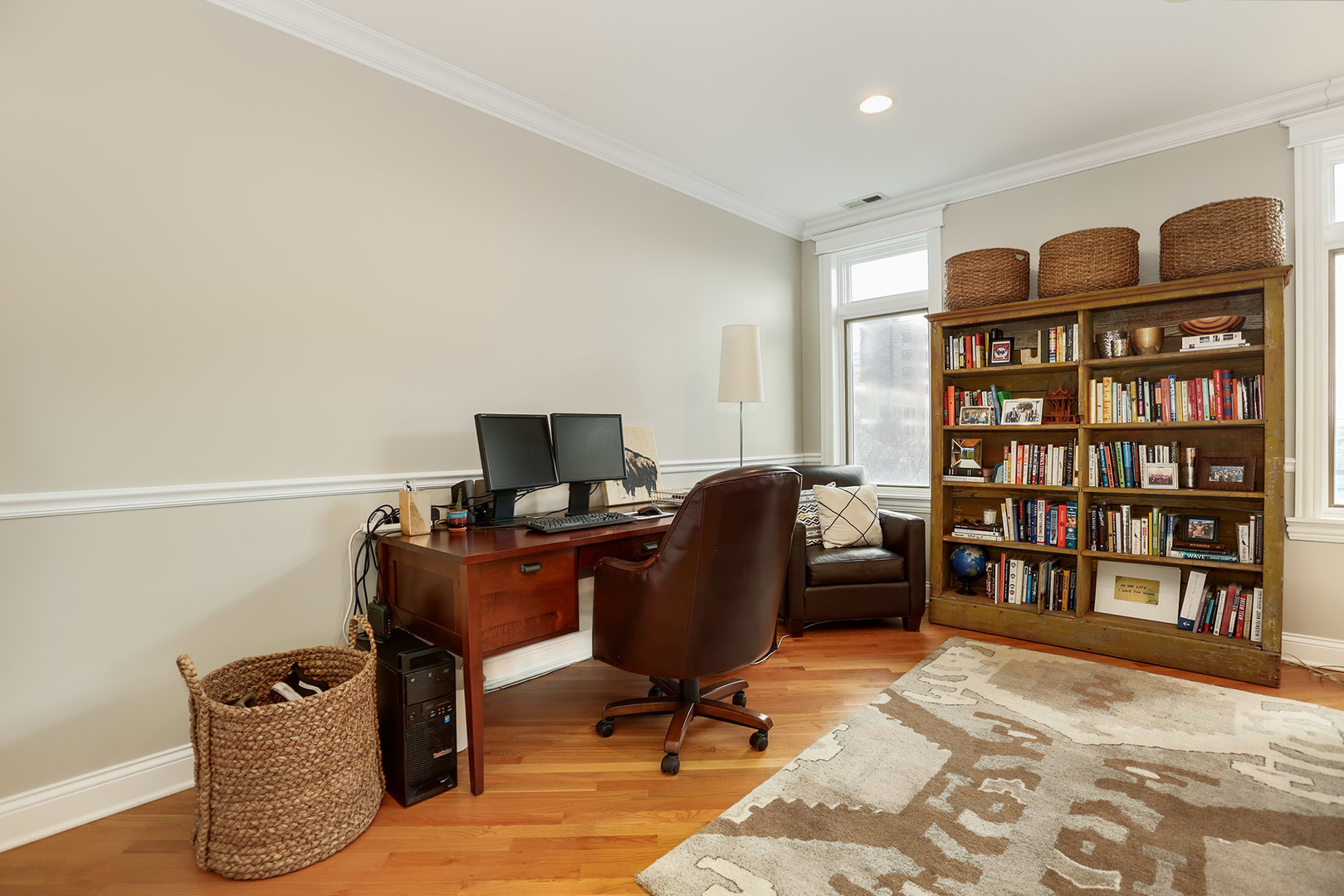 456 West Briar Place, Unit 4 Chicago, IL 60657 - Photo 7 of 30 a view of a workspace with furniture and a book shelf