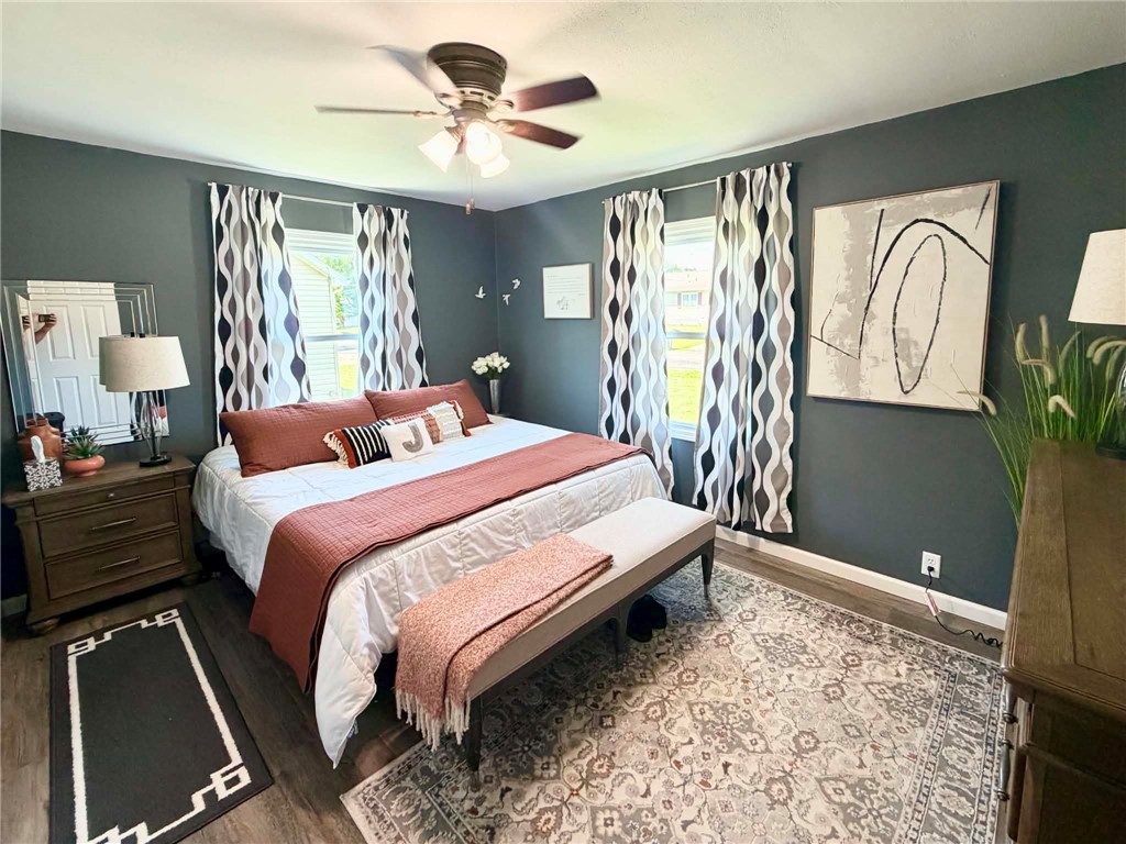 1108 South 3rd Street Effingham, IL 62401 - Photo 16 of 29 a bedroom with a large bed and a chandelier