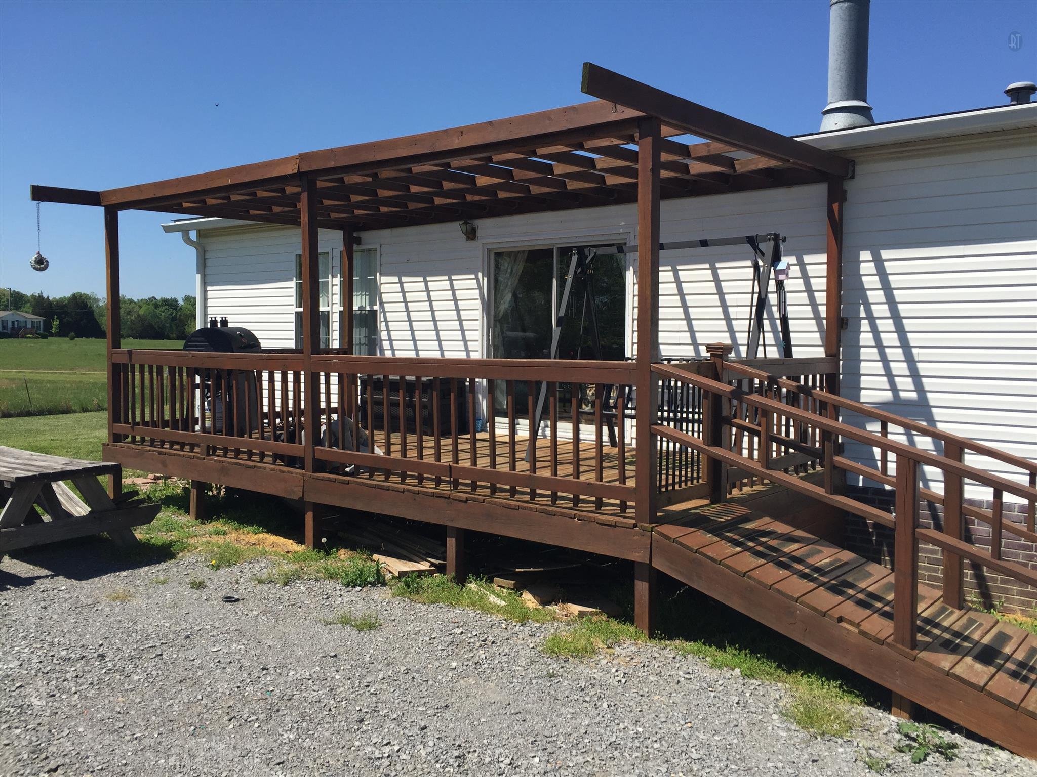 3832 Flewellyn Road Springfield, TN 37172 - Photo 13 of 19 a view of a wooden deck with a bench