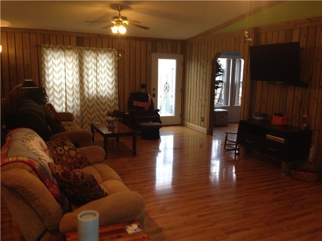 3832 Flewellyn Road Springfield, TN 37172 - Photo 5 of 19 a living room with furniture and a flat screen tv