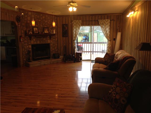 3832 Flewellyn Road Springfield, TN 37172 - Photo 7 of 19 a living room with furniture and a fireplace
