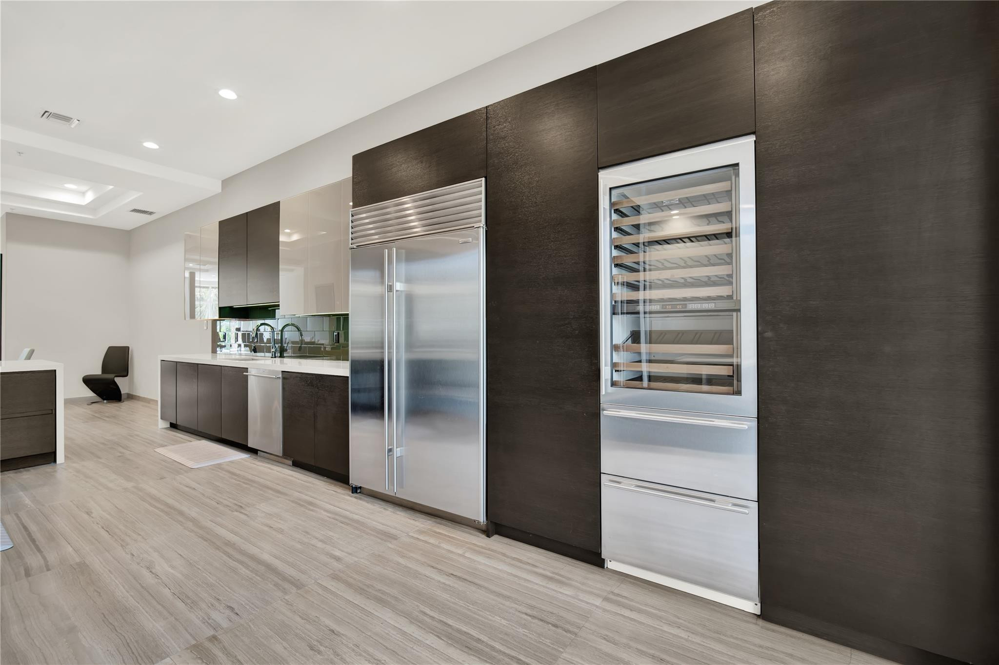 425 North Ocean Boulevard, Unit 3 Boca Raton, FL 33432 - Photo 31 of 69 a kitchen with stainless steel appliances a refrigerator and a sink