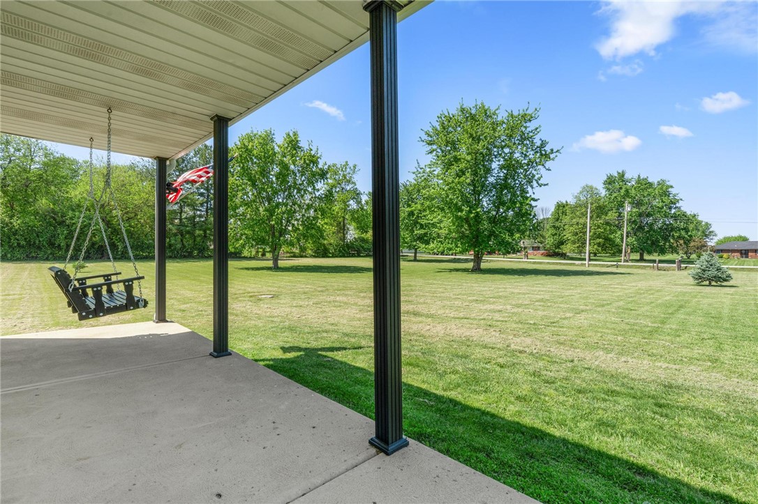 1353 Foust Road Xenia, OH 45385 - Photo 24 of 50 This inviting porch offers a tranquil retreat overlooking a lush, expansive yard.