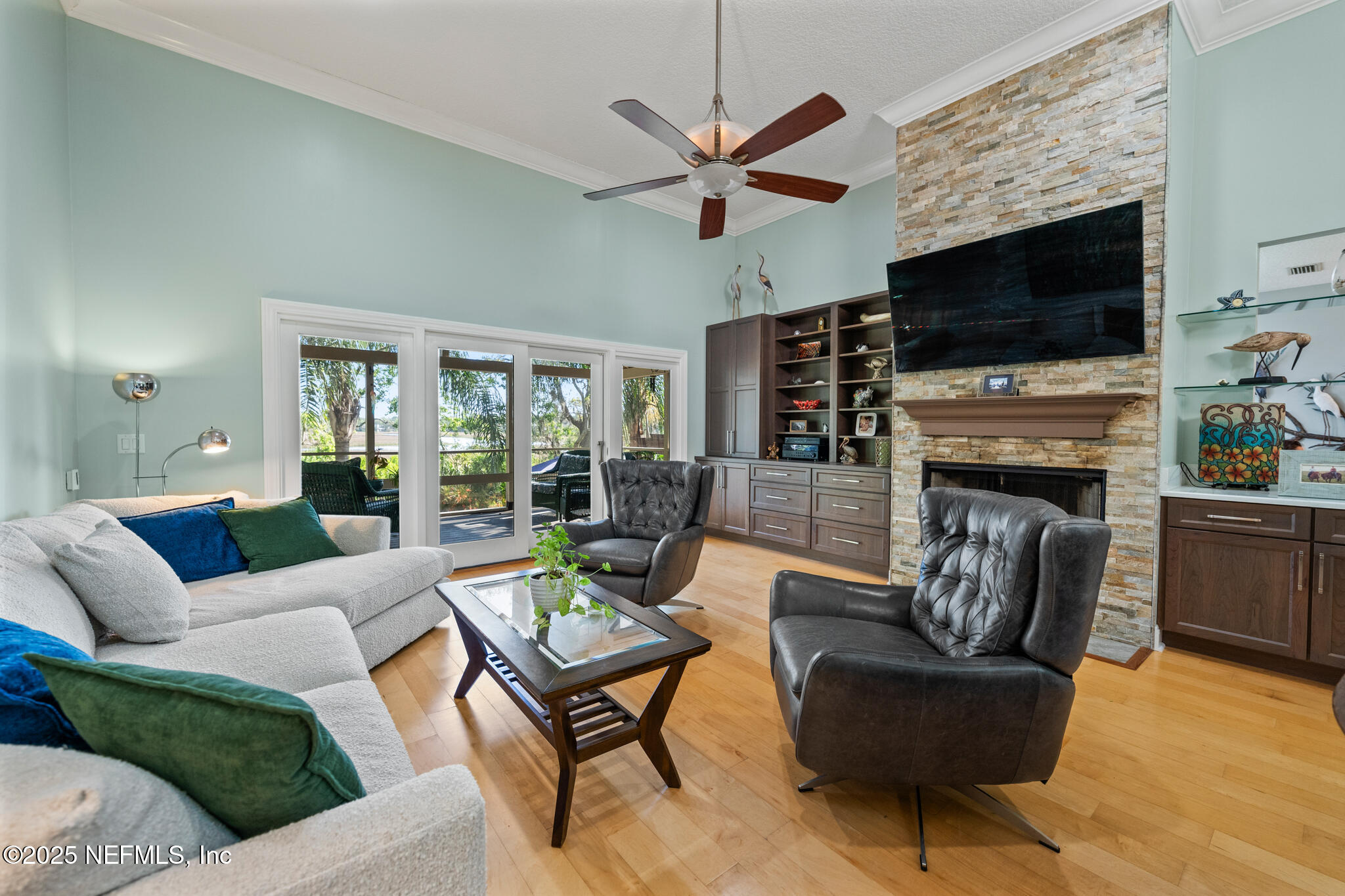 1836 Nightfall Drive Neptune Beach, FL 32266 - Photo 11 of 56 a living room with fireplace furniture and a flat screen tv