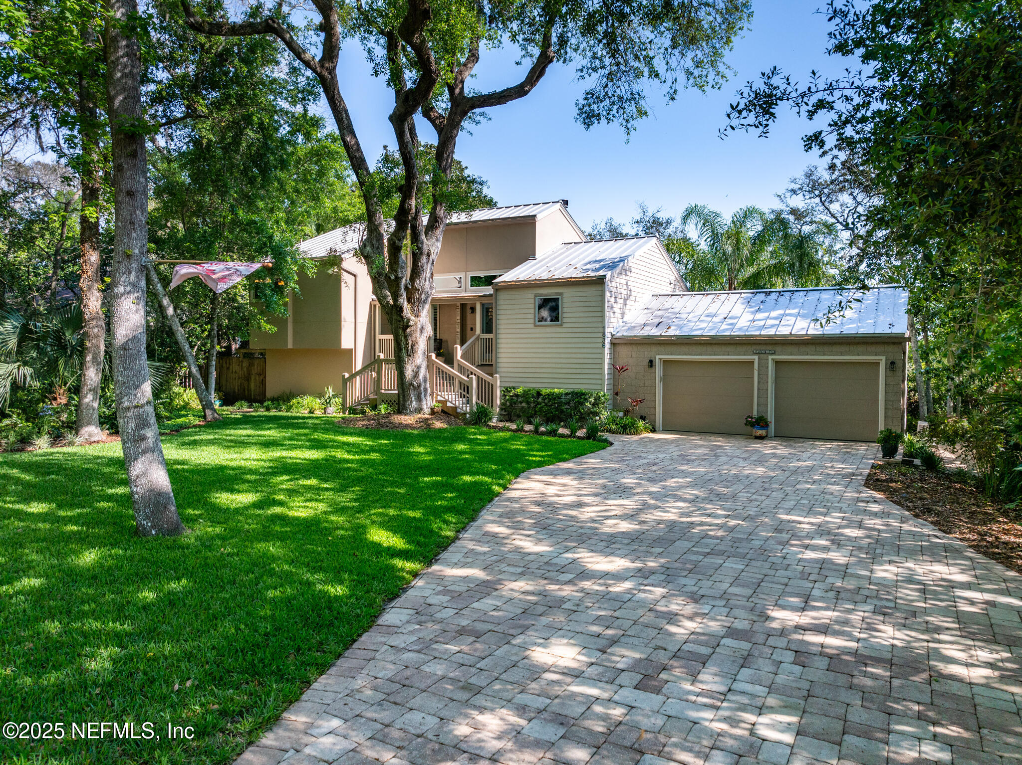 1836 Nightfall Drive Neptune Beach, FL 32266 - Photo 2 of 56 a front view of a house with garden