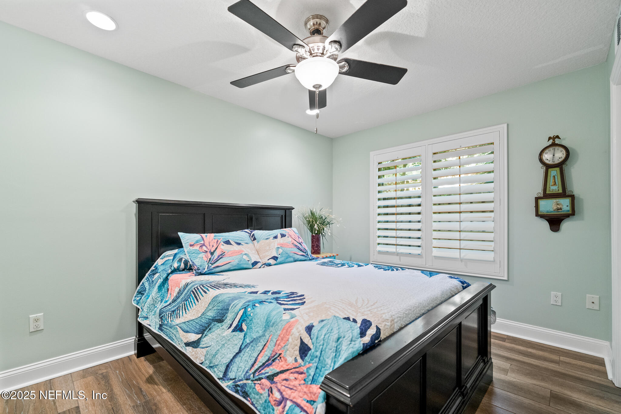 1836 Nightfall Drive Neptune Beach, FL 32266 - Photo 26 of 56 a bedroom with a bed and a chandelier