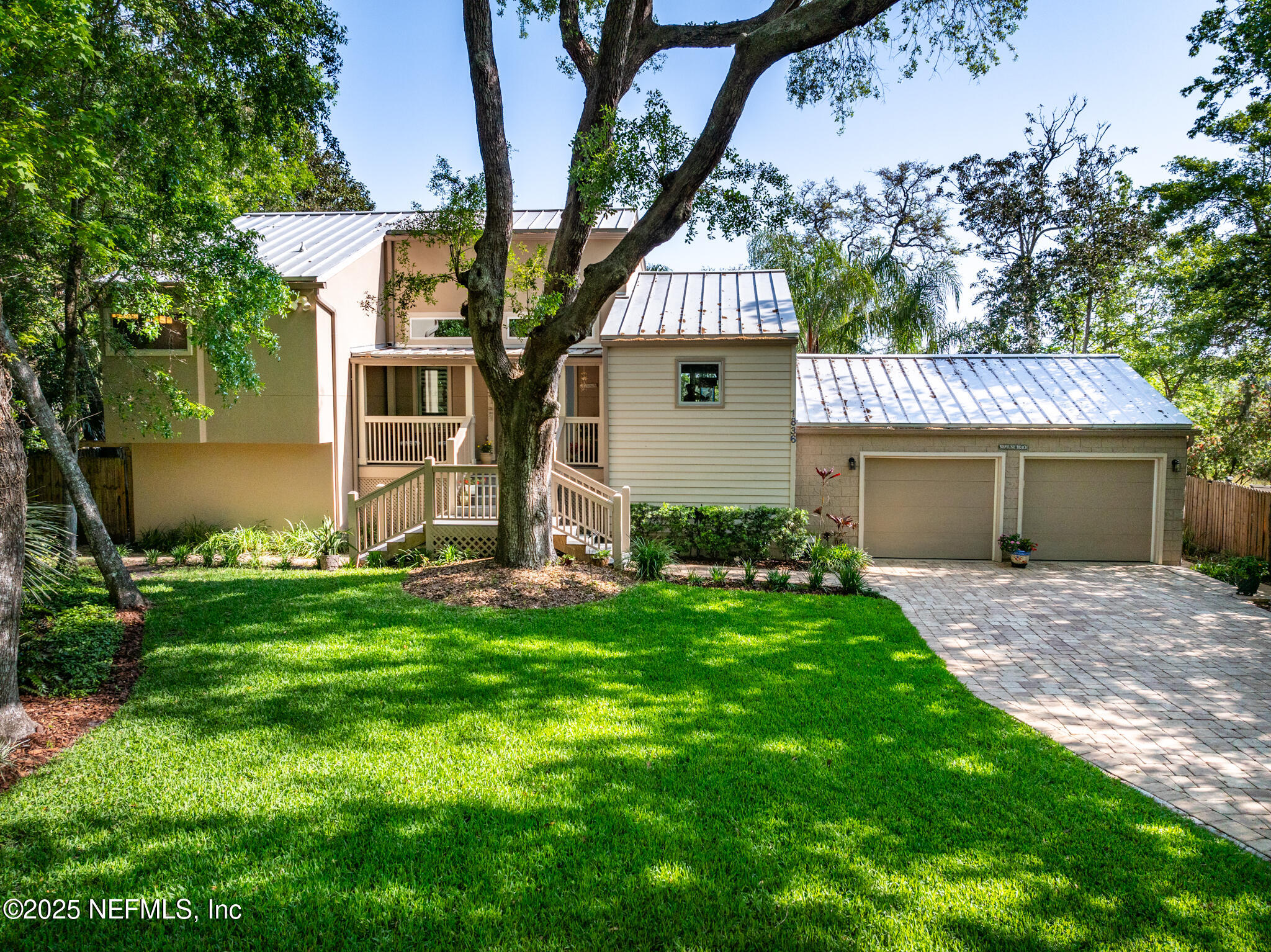 1836 Nightfall Drive Neptune Beach, FL 32266 - Photo 3 of 56 a front view of a house with a garden and yard