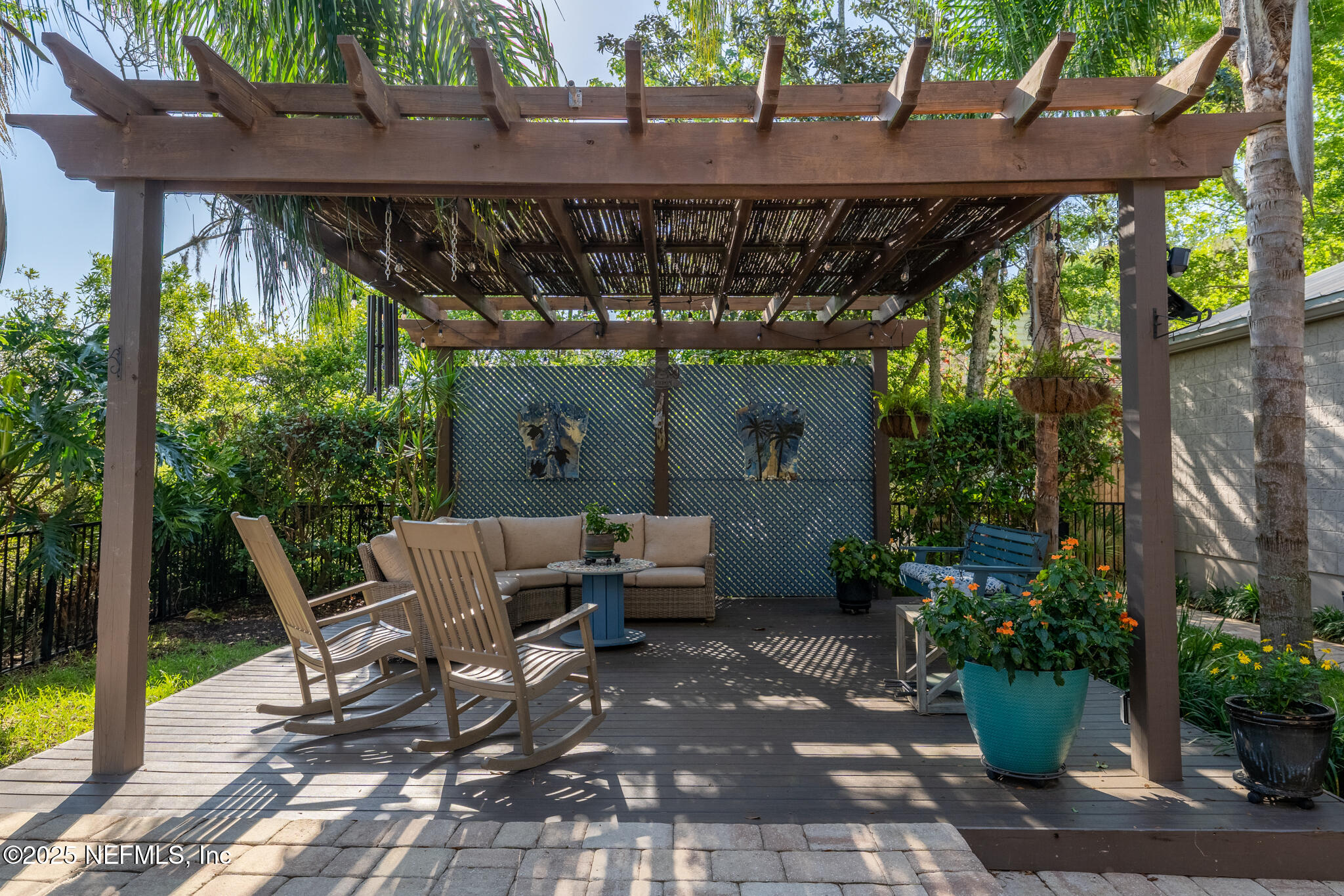 1836 Nightfall Drive Neptune Beach, FL 32266 - Photo 32 of 56 a view of patio with table and chairs potted plants and large tree