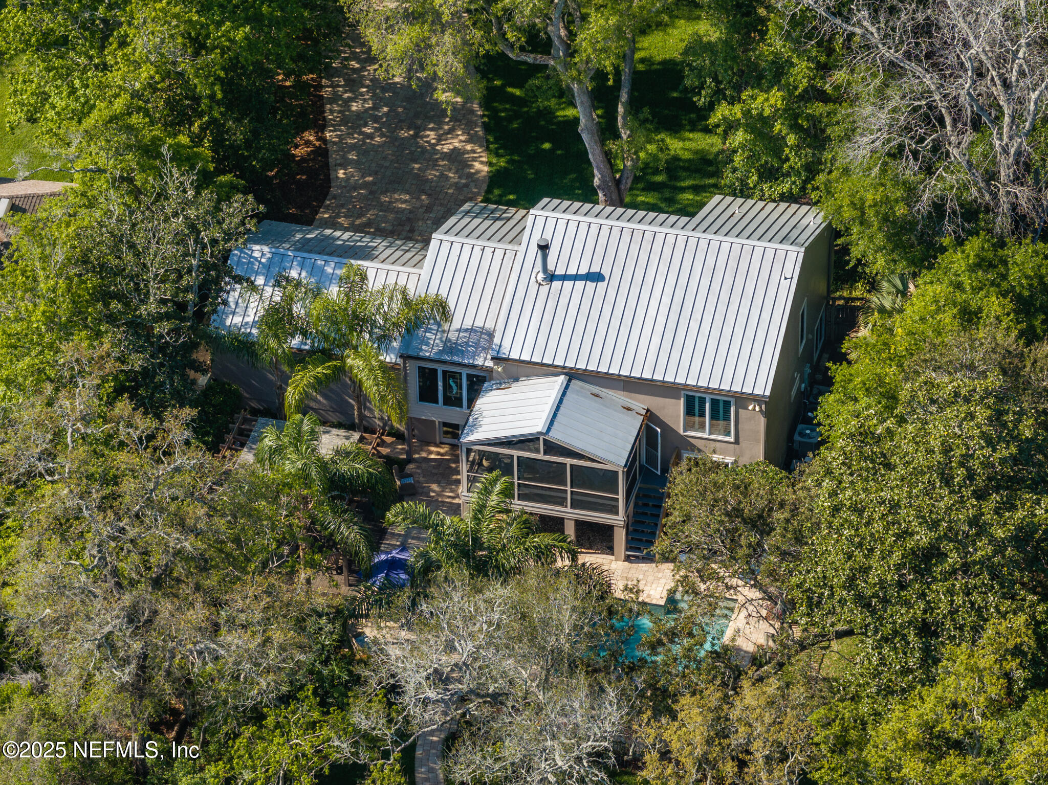 1836 Nightfall Drive Neptune Beach, FL 32266 - Photo 35 of 56 a view of a patio with table and chairs with wooden fence and plants