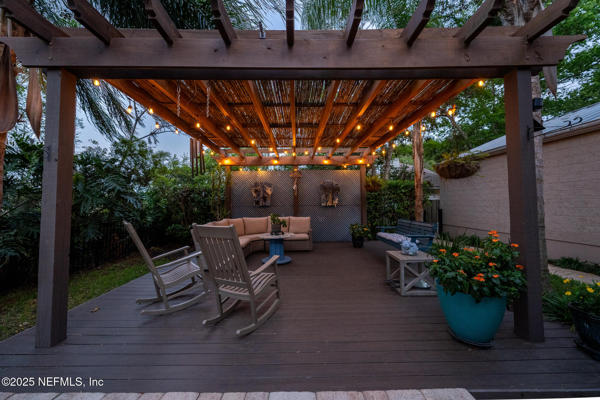 1836 Nightfall Drive Neptune Beach, FL 32266 - Photo 49 of 56 a view of a backyard with plants and a patio
